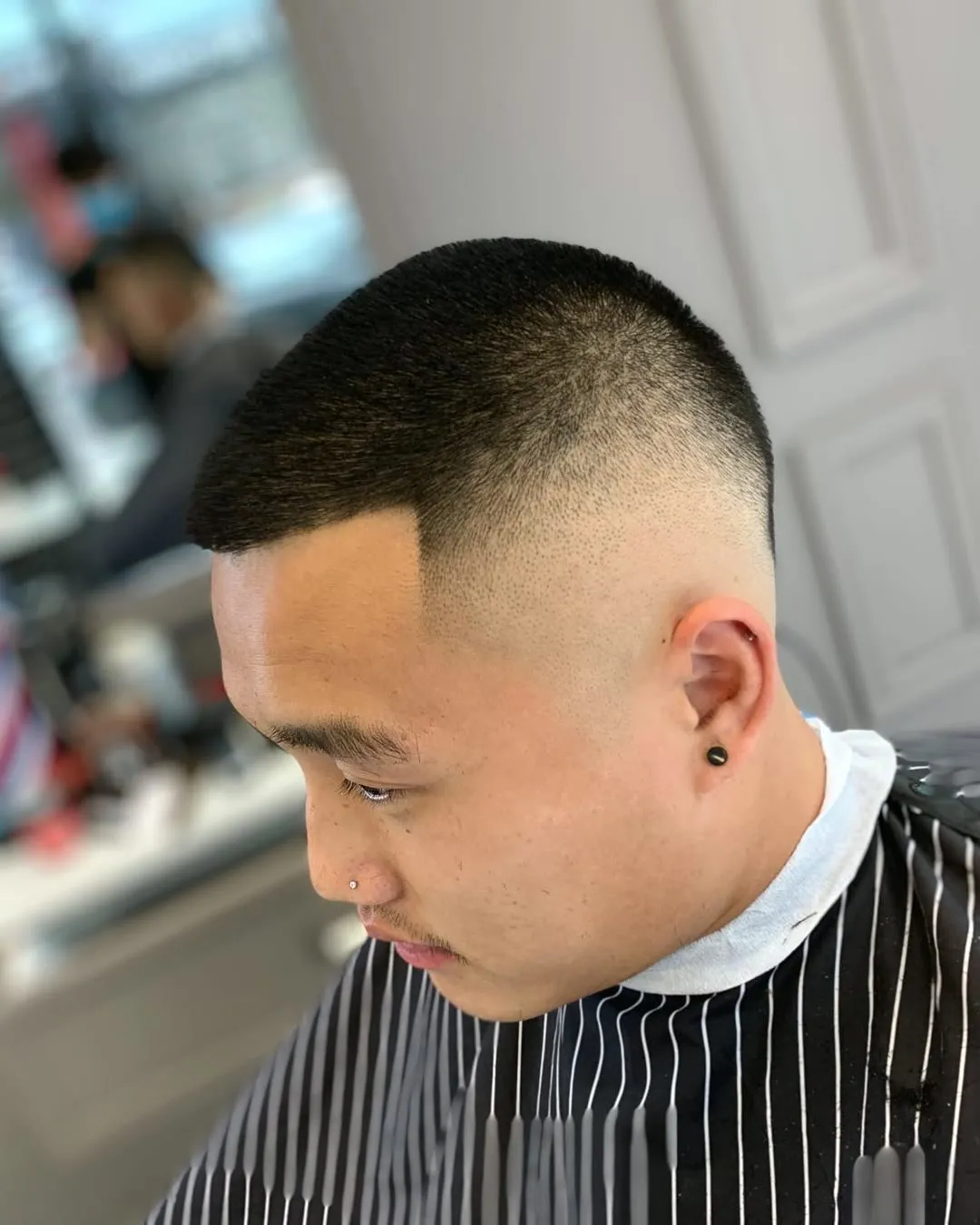 Short crew cut with a high fade and a crisp lineup